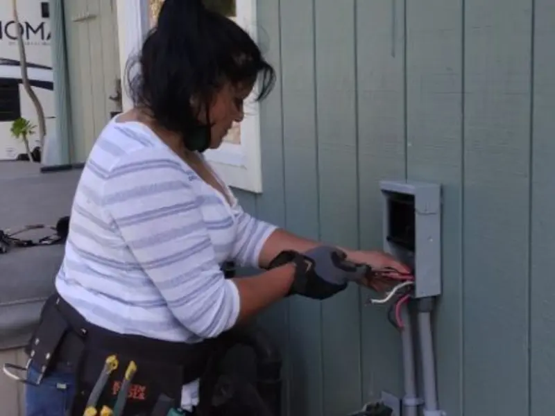 Licensed electrician wiring an exterior subpanel in Sudden Valley